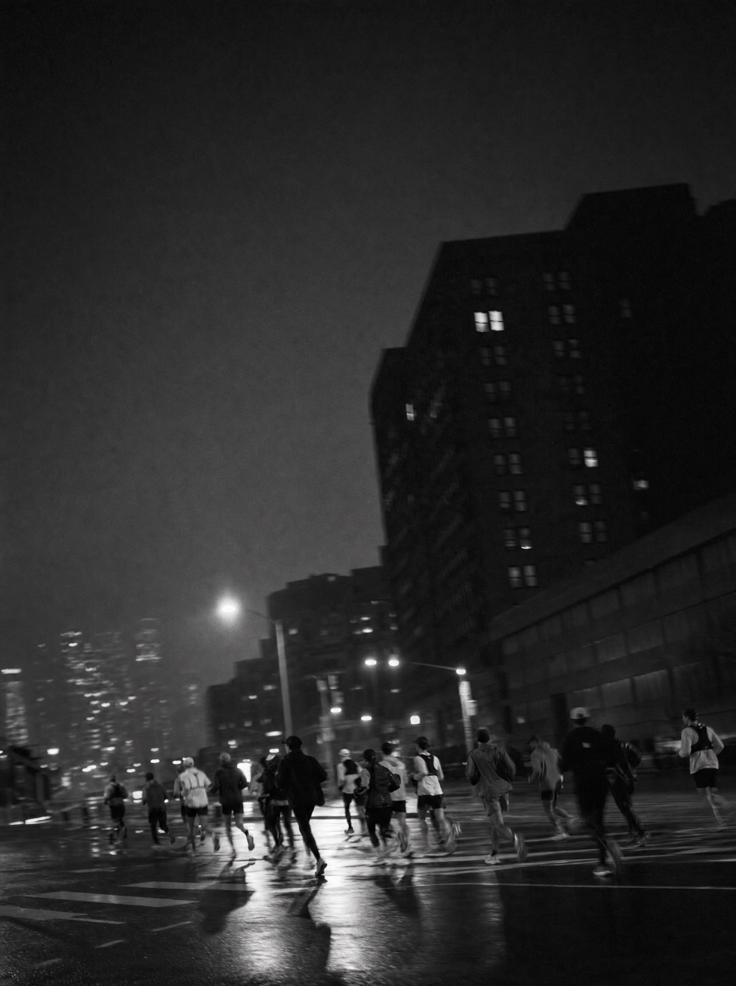 A group running together through a city at night.